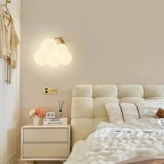 Zenvia Essentials Cloud-Shaped LED Wall Lights for Living Room hang above a white nightstand in a modern bedroom.