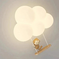 Zenvia Essentials Cloud-Shaped LED Wall Lights for Living Room with a brown monkey figurine on a wooden stick