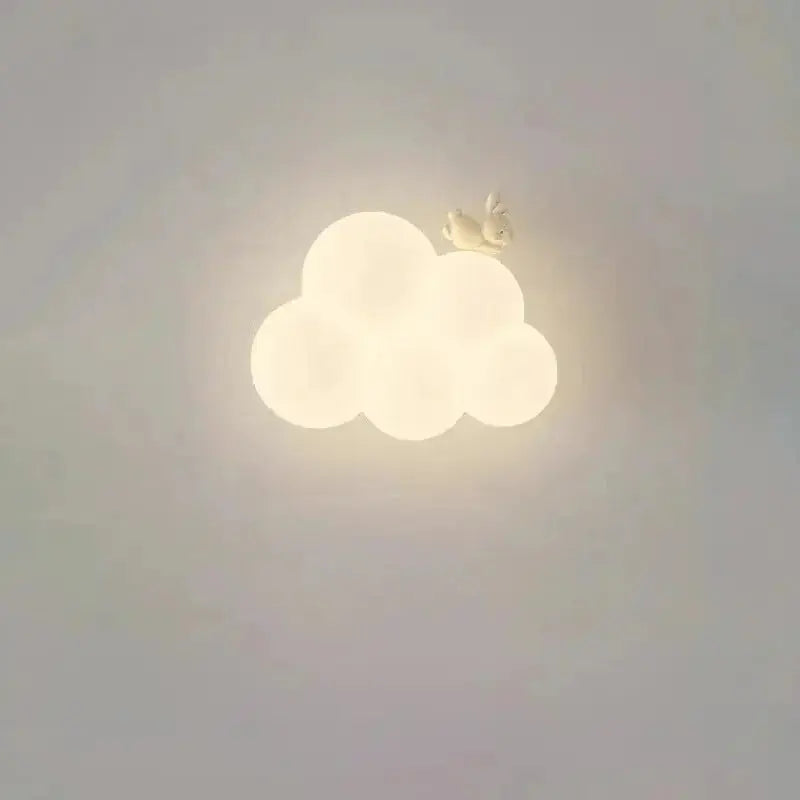 Zenvia Essentials Cloud-Shaped LED Wall Light fixture hanging from a ceiling in a living room