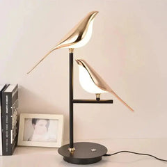 Zenvia Essentials Golden Bird Table Lamp for Bedroom with black base and gold bird-shaped lampshade