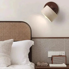 Zenvia Essentials Minimalist Travertine Stone LED Wall Light in a modern bedroom setting