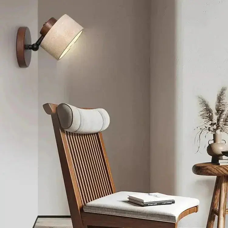 Zenvia Essentials Minimalist Travertine Stone LED Wall Light on a white-painted wall