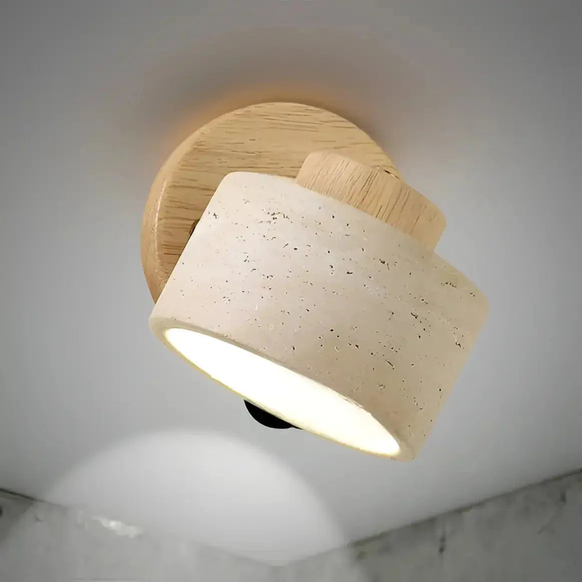 Zenvia Essentials Minimalist Travertine Stone LED Wall Light with beige fabric-covered base and cylindrical design