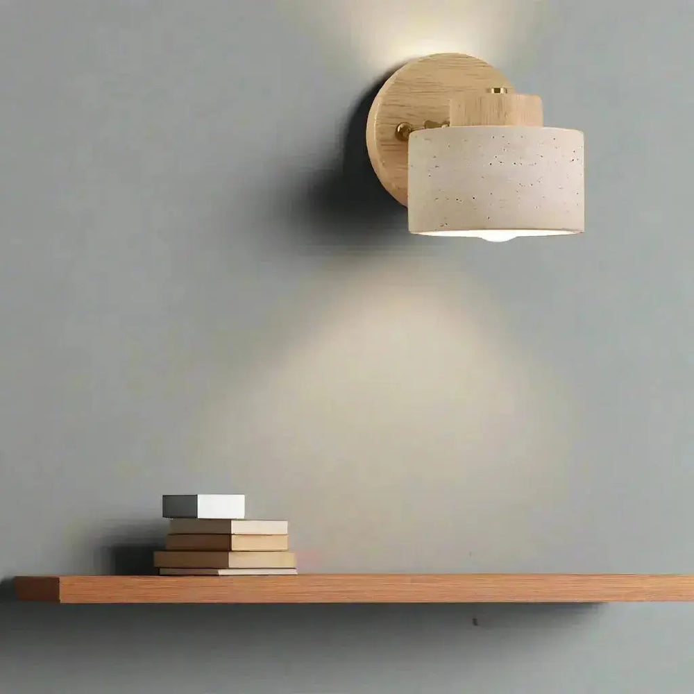 Zenvia Essentials Minimalist Travertine Stone LED Wall Light on a gray wall