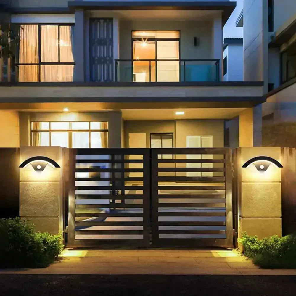 Zenvia Essentials Modern Curved LED Motion Sensor Wall Light on a modern house entrance