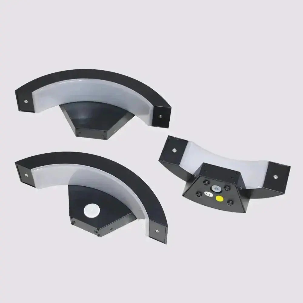 Three black metal Zenvia Essentials brackets with curved design and adjustable height