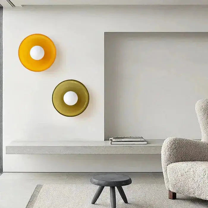 Three Zenvia Essentials Modern Round Glass Ceiling Lights in different colors: orange, yellow, and white for a bedroom.