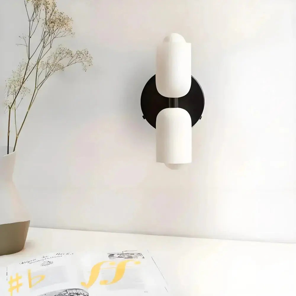 Zenvia Essentials Modern Up Down Acrylic Wall Light with black base and white cylindrical shades