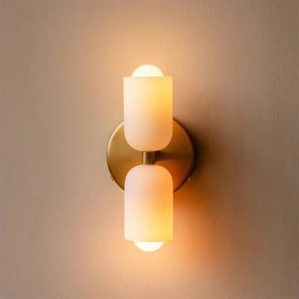 Zenvia Essentials Modern Up Down Acrylic Wall Light with brass base and two white frosted glass shades