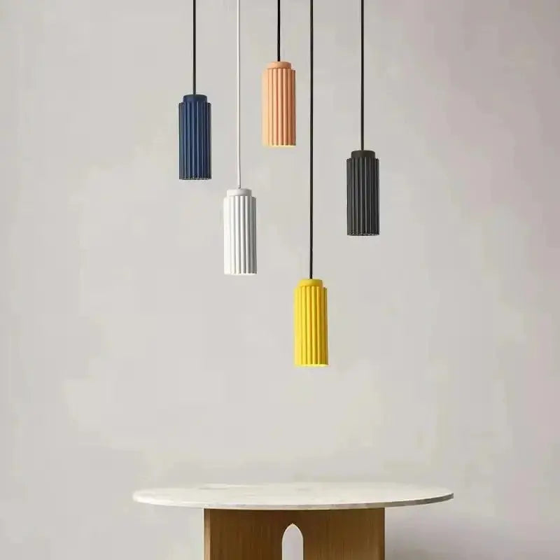 Five Zenvia Essentials Nordic Minimalist Pendant Lights in various colors hanging from a black cord