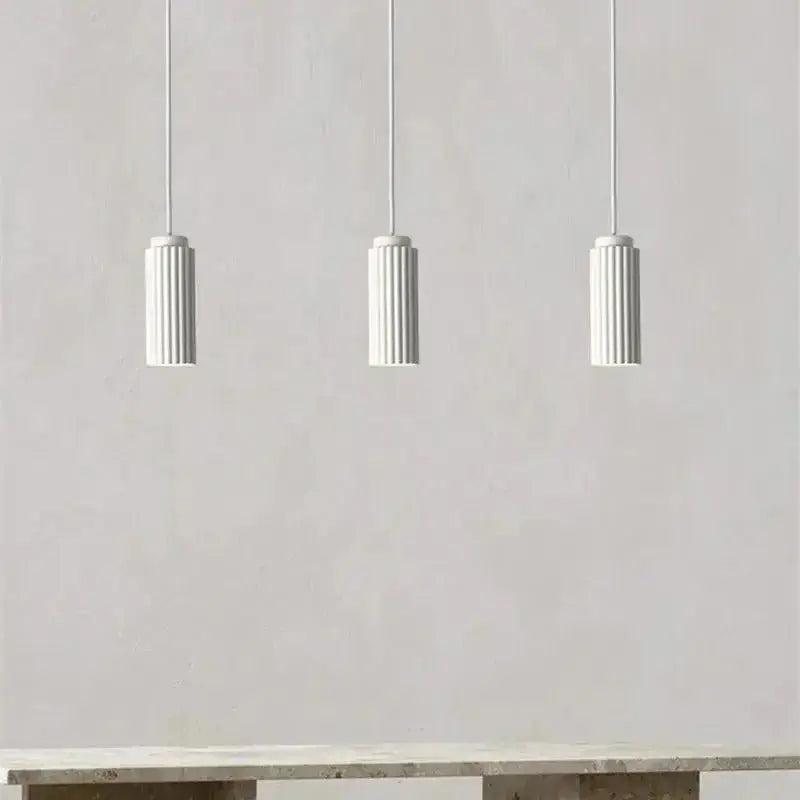 Zenvia Essentials Nordic Minimalist Pendant Light with textured surfaces hanging from a white ceiling.