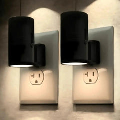 Two black Zenvia Essentials Plug-in LED Wall Lights for Bedroom mounted on a beige wall.
