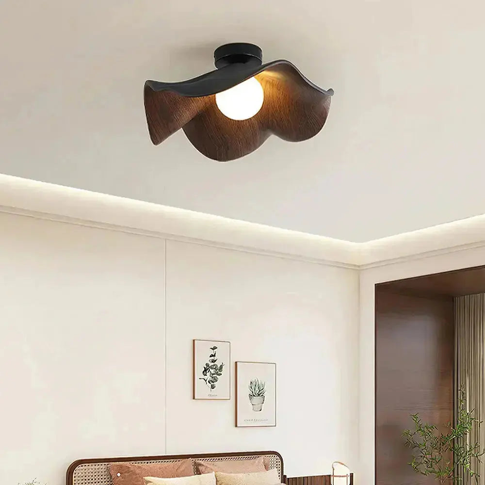 Zenvia Essentials Scandinavian Wood Ceiling Lights with curved wood design and round bulb in a modern bedroom