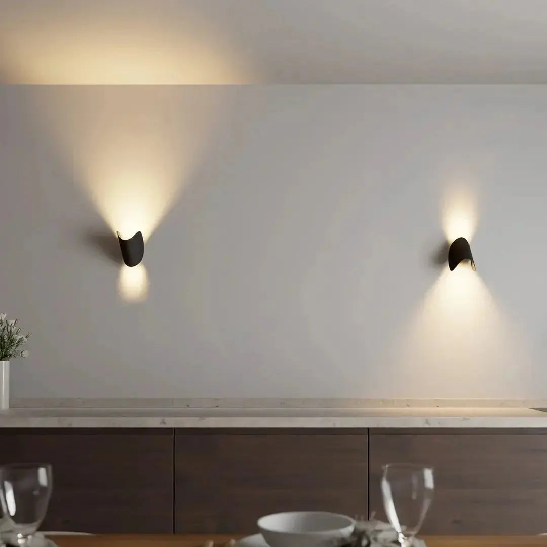 Black Zenvia Essentials Up & Down Modern Wall Sconce Light in a minimalist kitchen