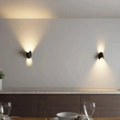 Black Zenvia Essentials Up & Down Modern Wall Sconce Light in a minimalist kitchen